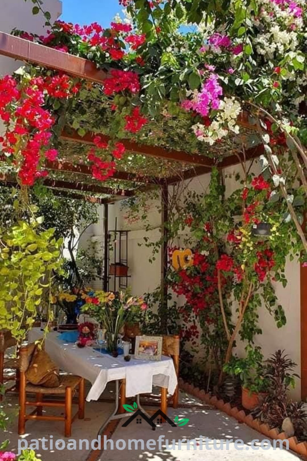 Outdoor dining area featuring potted plants and vibrant flowers, creating a cozy and inviting atmosphere ideal for gatherings, with design ideas from wellnesswink.com.