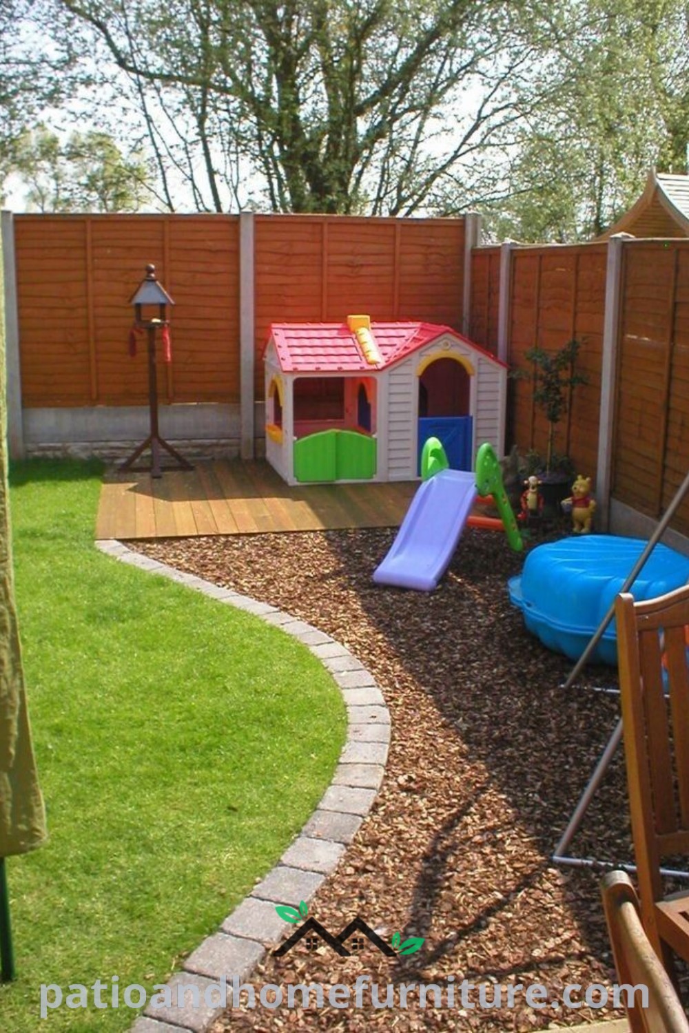 Cozy backyard play area with wooden fence, vibrant play equipment, and cheerful decor ideas for kids, perfect for family fun and creating a joyful outdoor space at wellnesswink.com.