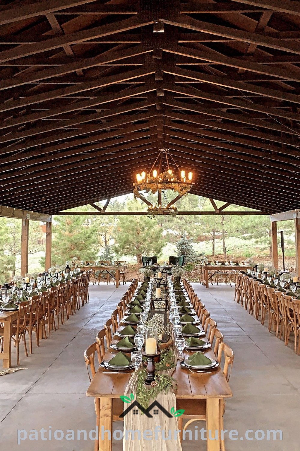 Outdoor dining area set up for a formal function with long rustic wooden tables, elegant chandeliers, and cozy seating arrangements, providing inviting decor ideas for a memorable wedding atmosphere. Visit wellnesswink.com for more unique inspirations.
