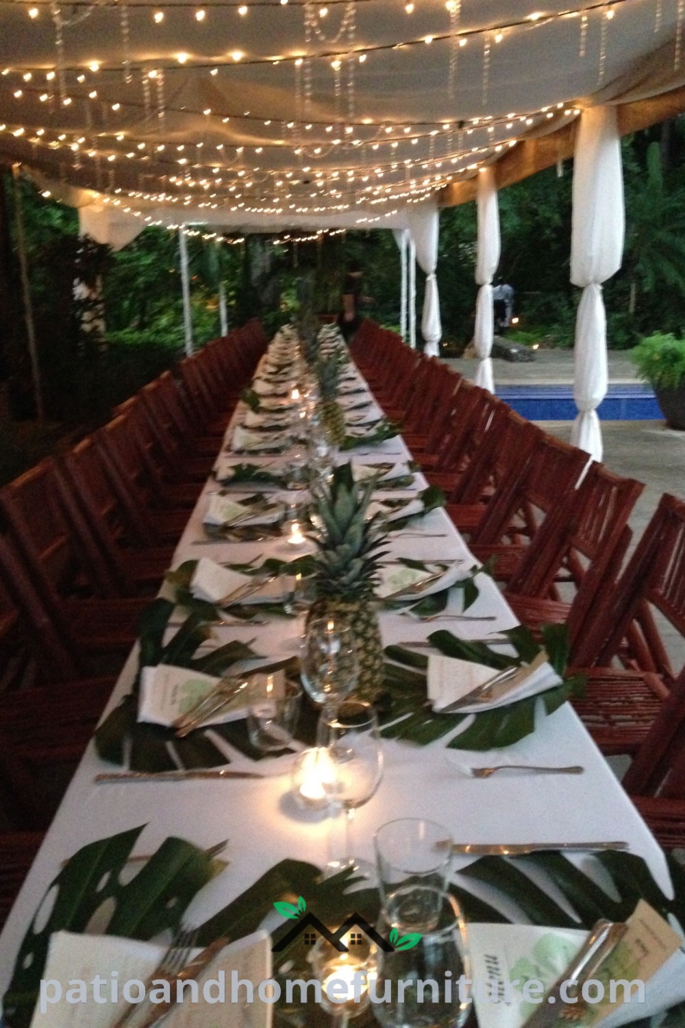 Long table beautifully set for 40-person wedding and various celebrations, with twinkling lights overhead, showcasing cozy decor inspirations and unique design ideas for events, available at wellnesswink.com.