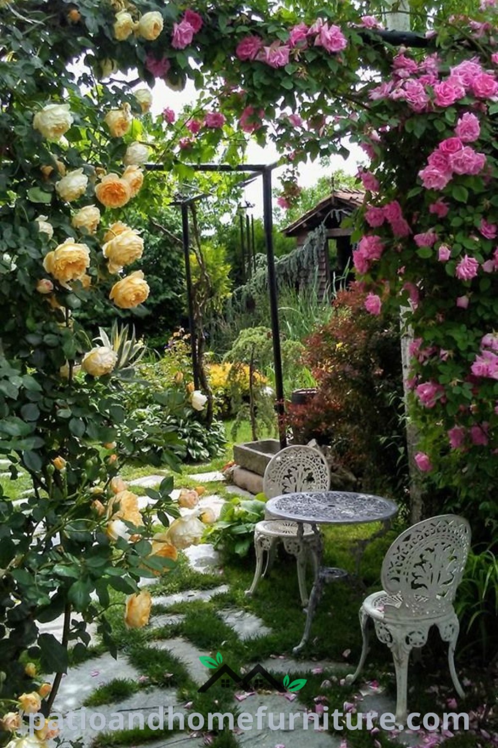 Two white chairs in a lush green field adjacent to a colorful flower garden, showcasing cozy design ideas for summer decor and garden inspiration, perfect for creating a welcoming outdoor space on wellnesswink.com.