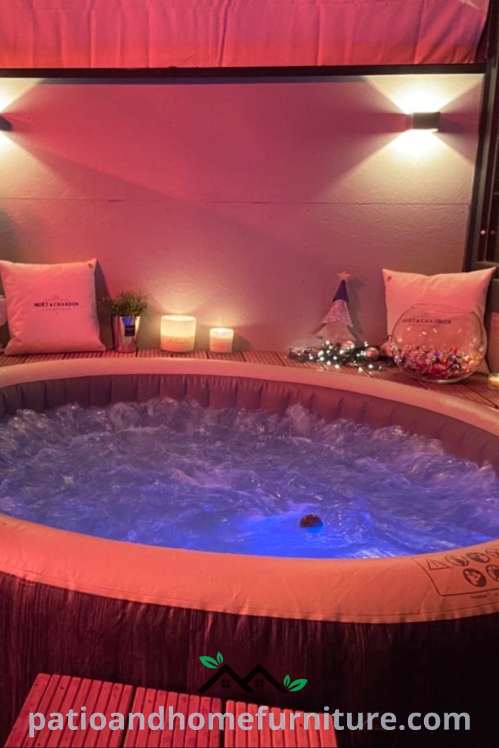 Indoor hot tub in a cozy setting with lit candles in the corner and soft pillows on the floor, creating an inviting atmosphere for relaxation, featuring design ideas for a personal wellness space at wellnesswink.com.