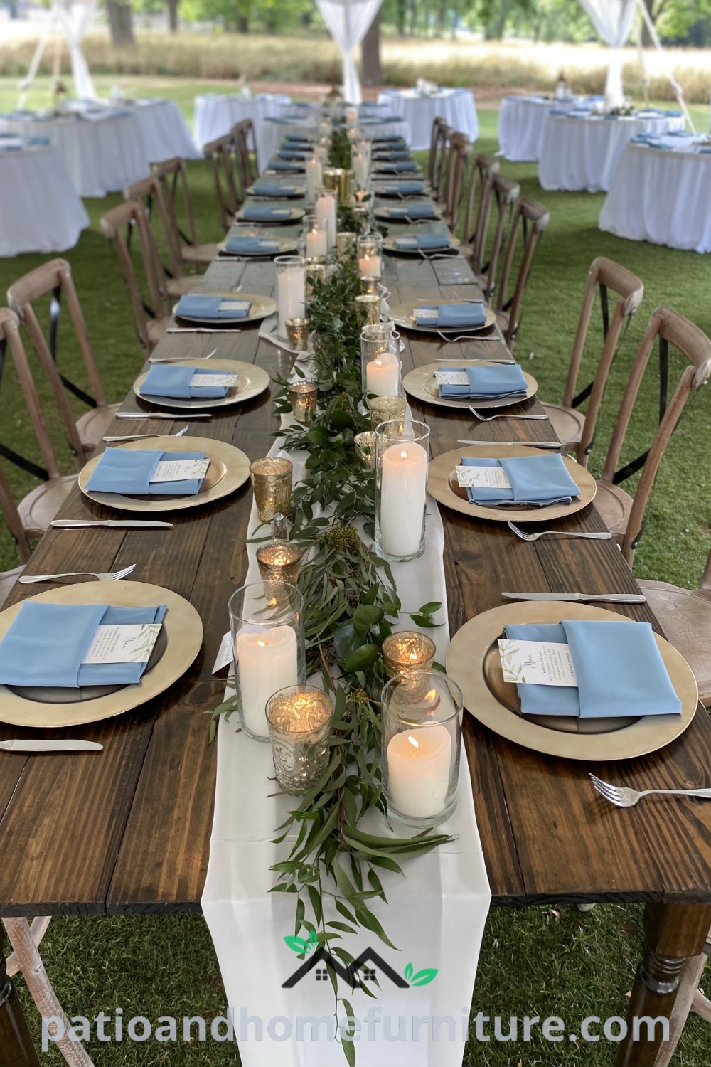 Long outdoor dinner table set with candles and elegant place settings in the grass, showcasing a charming rustic decor ideal for events like Quinceanera or weddings, featuring cozy ideas and inspiring decor inspirations for your home, from wellnesswink.com.