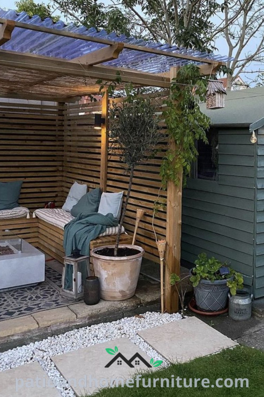 Cozy outdoor living area featuring wood slats, potted plants, and a charming pergola, showcasing unique design ideas that enhance privacy and aesthetics, ideal for creating an inspiring garden space at wellnesswink.com.