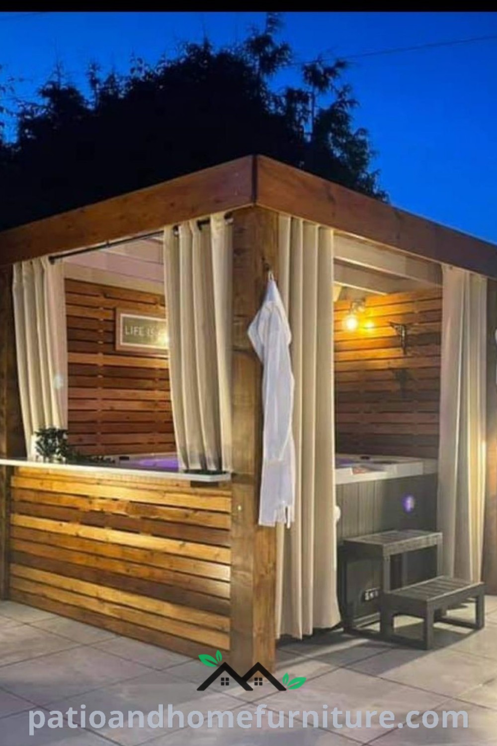 Outdoor hot tub with curtains for privacy, surrounded by a stylish deck and inviting seating, creating a cozy retreat for relaxation and enjoyment, featured on wellnesswink.com.