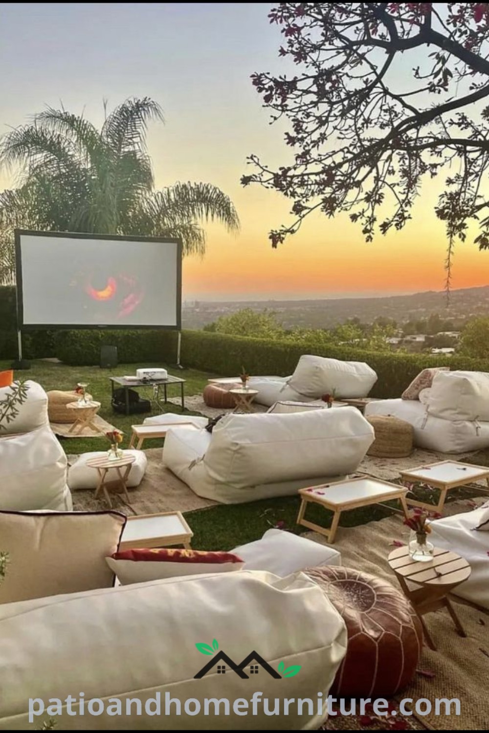 Outdoor movie setup in a grassy backyard with white pillows and chairs, creating a cozy atmosphere for film nights, while inspiring decor ideas for a unique home experience on wellnesswink.com.