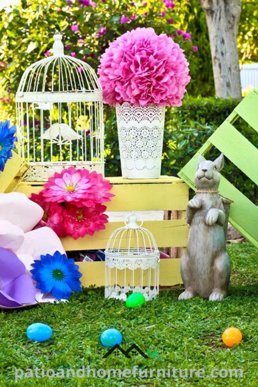 An assortment of colorful flowers and decorations on grass in front of a birdcage, creating a festive Easter photoshoot backdrop that inspires cozy, unique ideas for your home and photography settings, wellnesswink.com.