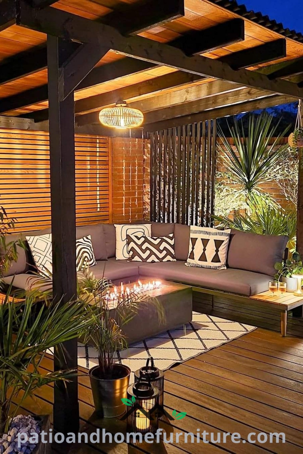 Nighttime outdoor living area with cozy couches, tables, and plants on the deck, creating a warm and inviting retreat, with design ideas for enhancing comfort and ambiance, featured at wellnesswink.com.