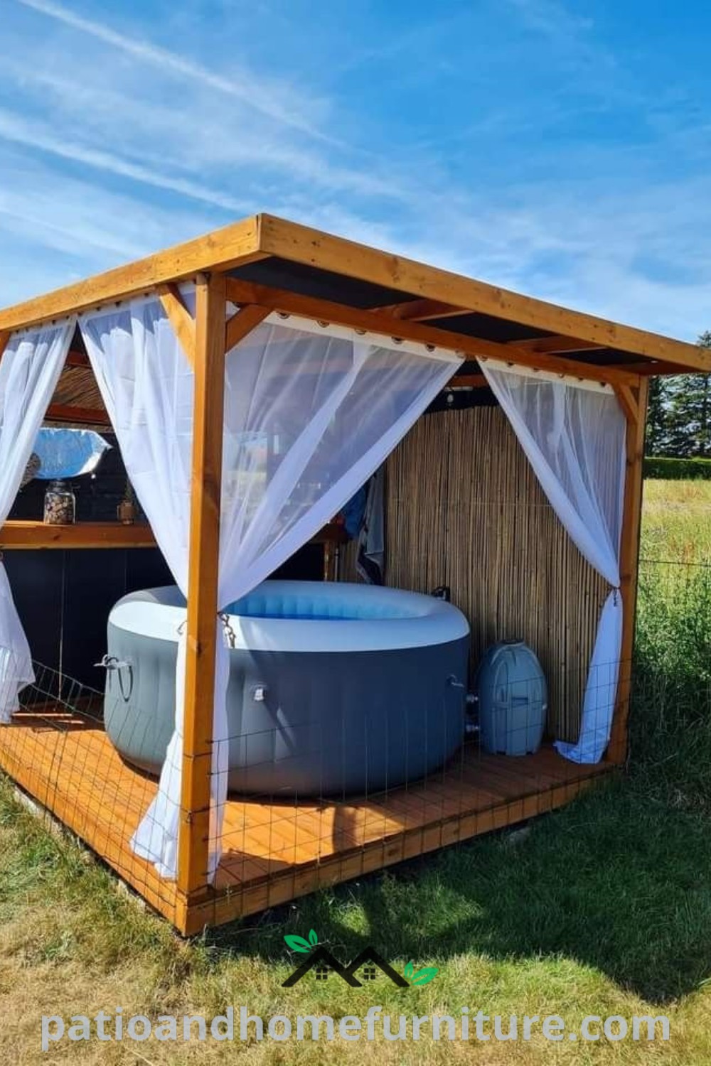 Cozy hot tub in an open field with curtains for privacy, surrounded by nature, offering inspiring decor ideas for a tranquil outdoor retreat. Visit wellnesswink.com for more unique ideas.