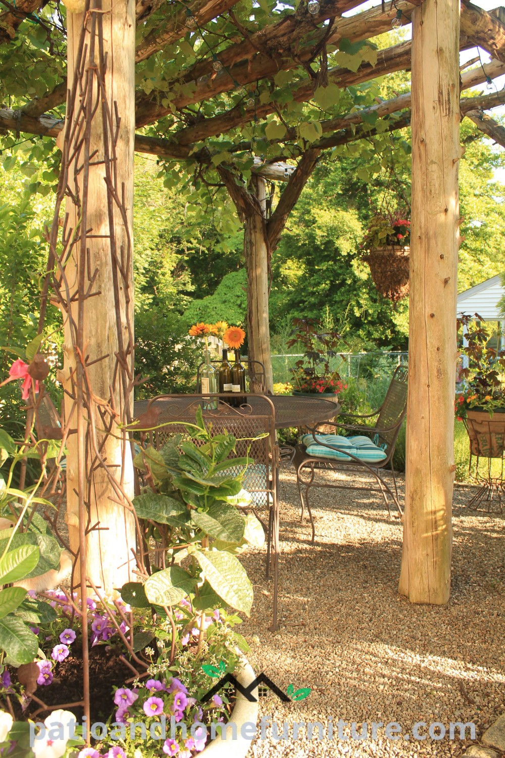 Outdoor dining area with tables and chairs surrounded by lush plants and flowers, creating a cozy and inviting atmosphere, perfect for gatherings or weddings, featured on wellnesswink.com with unique decor ideas and inspirations.