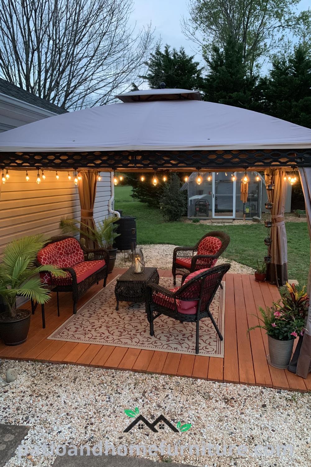 Cozy backyard patio featuring stylish furniture, twinkling lights, and lush greenery, creating an inviting space ideal for relaxation and gatherings, showcased on wellnesswink.com.