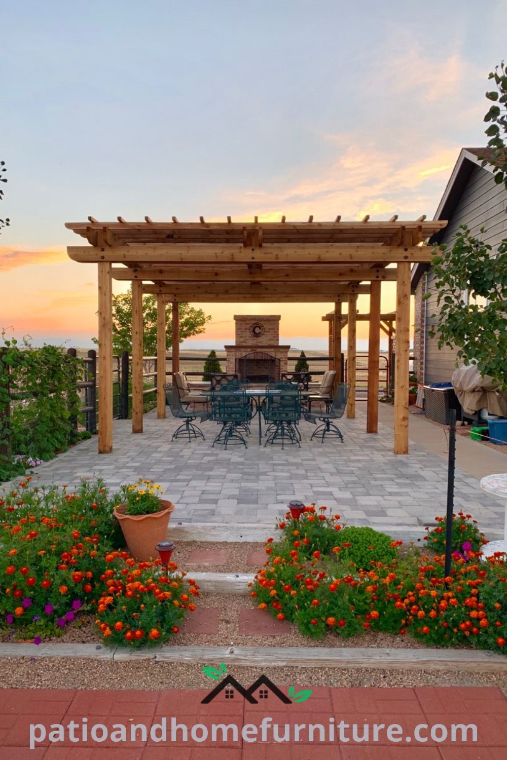 A cozy outdoor dining area adorned with potted plants and flowers, set against a stunning sunset backdrop, featuring a cedar pergola and DIY home bar, creating inviting decor inspirations for your home at wellnesswink.com.