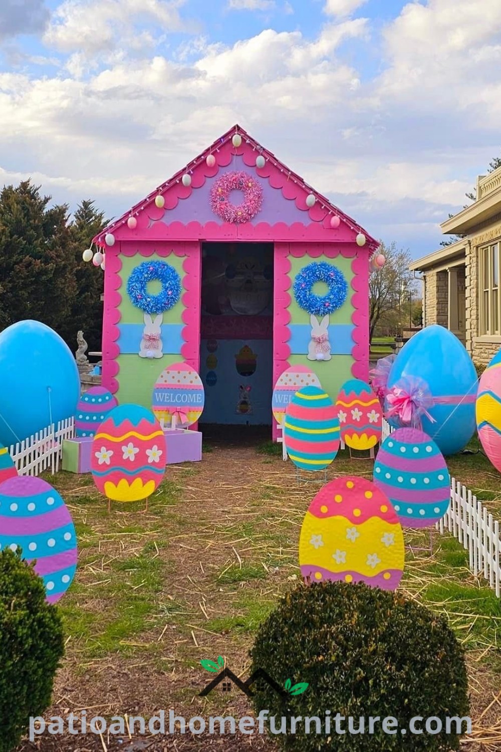 Easter decoration featuring large colorful eggs and bunny sculptures on a green lawn in front of a house, creating a festive atmosphere, ideal for a cozy home, with unique ideas for outdoor decor at wellnesswink.com.