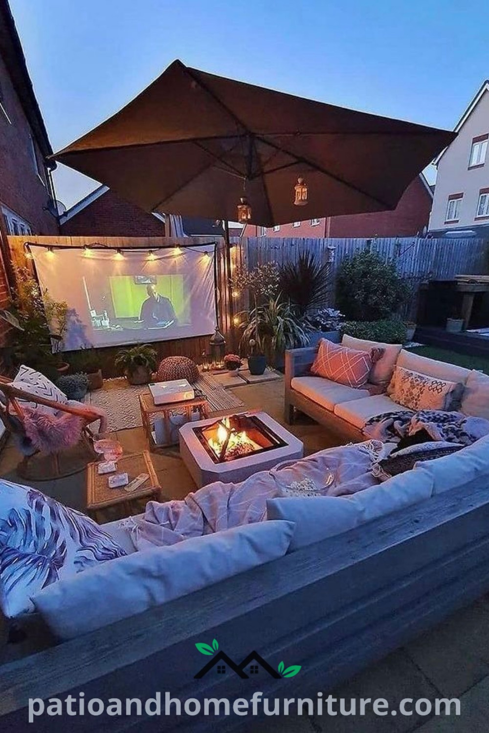 Cozy outdoor living area designed for movie nights featuring comfortable couches, tables, and umbrellas, creating an inviting atmosphere for relaxation and entertainment under the stars. Visit wellnesswink.com for more cozy ideas and design inspirations.