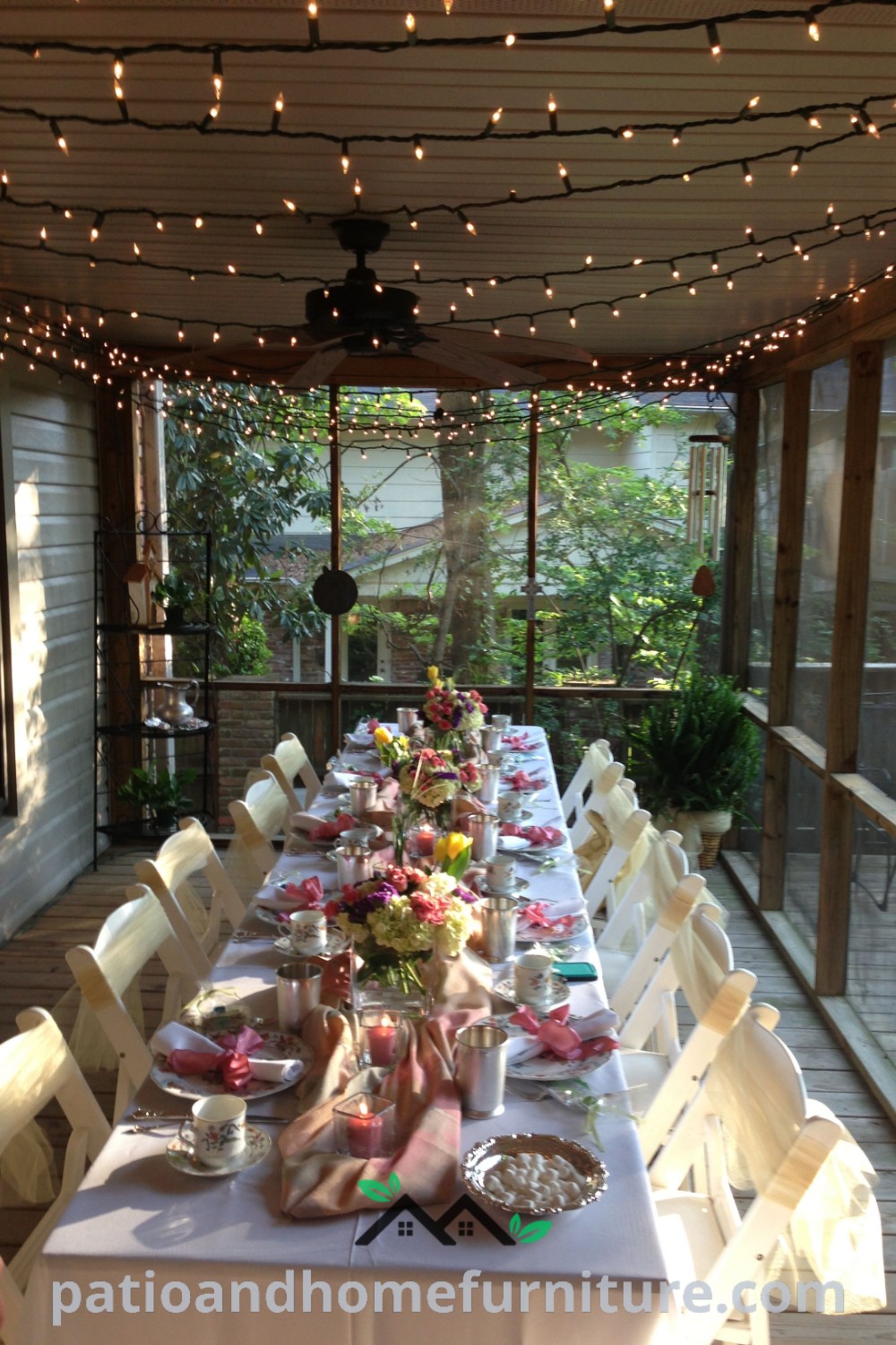 Cozy porch party setup with a long table and white chairs, featuring elegant decorations and inviting colors, creating a charming atmosphere perfect for gatherings; discover unique ideas for your home at wellnesswink.com.