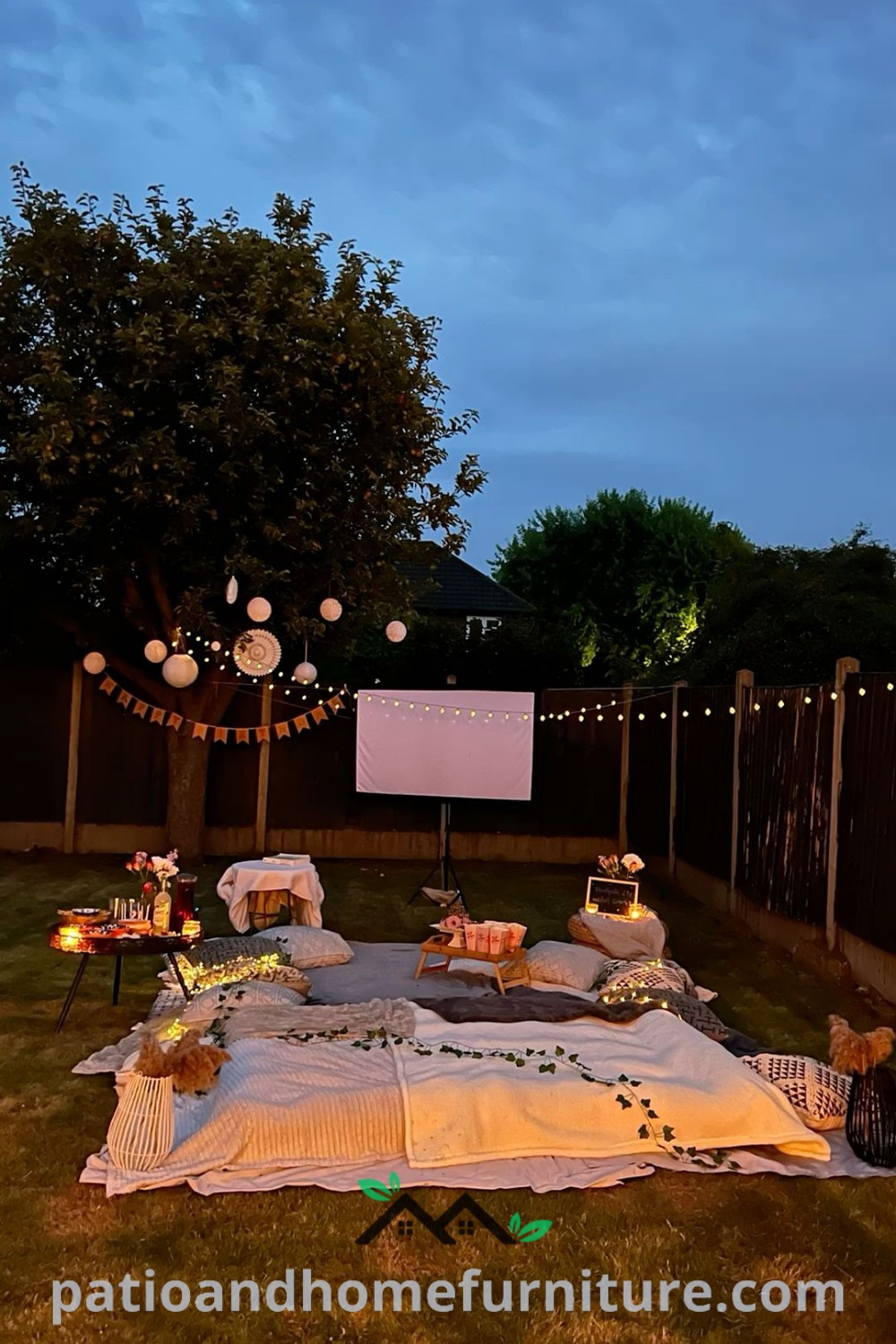 Outdoor movie night setup on grass with string lights, cozy blankets, and a projector screen, creating a charming and inviting atmosphere for gatherings, offering unique ideas and decor inspirations for memorable summer events at wellnesswink.com.