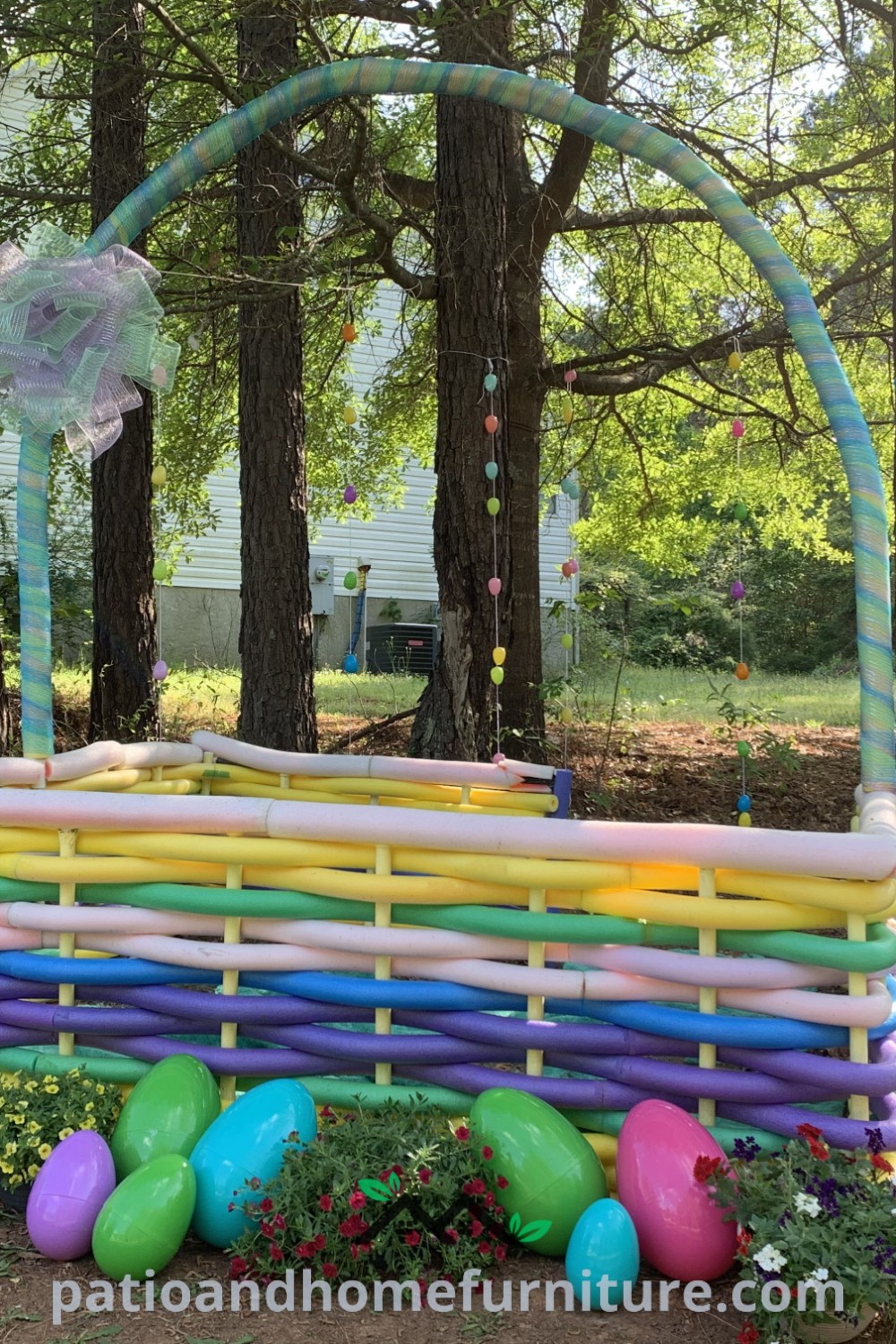 A cozy Easter basket made of sticks, filled with colorful eggs in the grass near trees, illustrating charming decor ideas for festive celebrations found on wellnesswink.com.