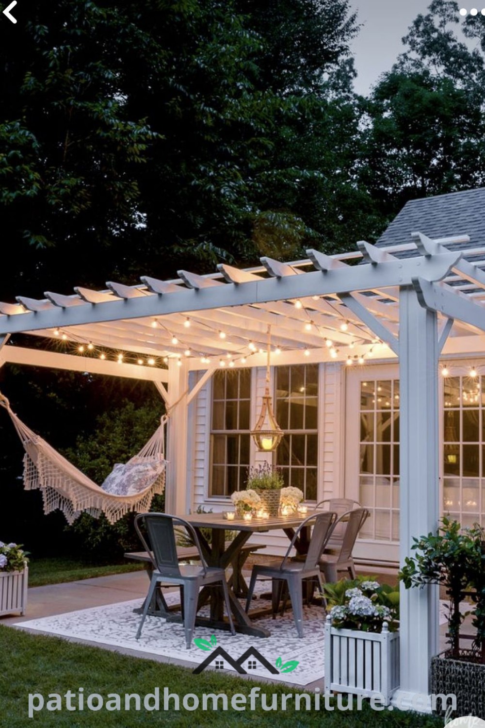 Cozy outdoor dining area with string lights and a hammock, surrounded by charming pergola decor, providing inspiration for unique patio designs and ideas for your home at wellnesswink.com.