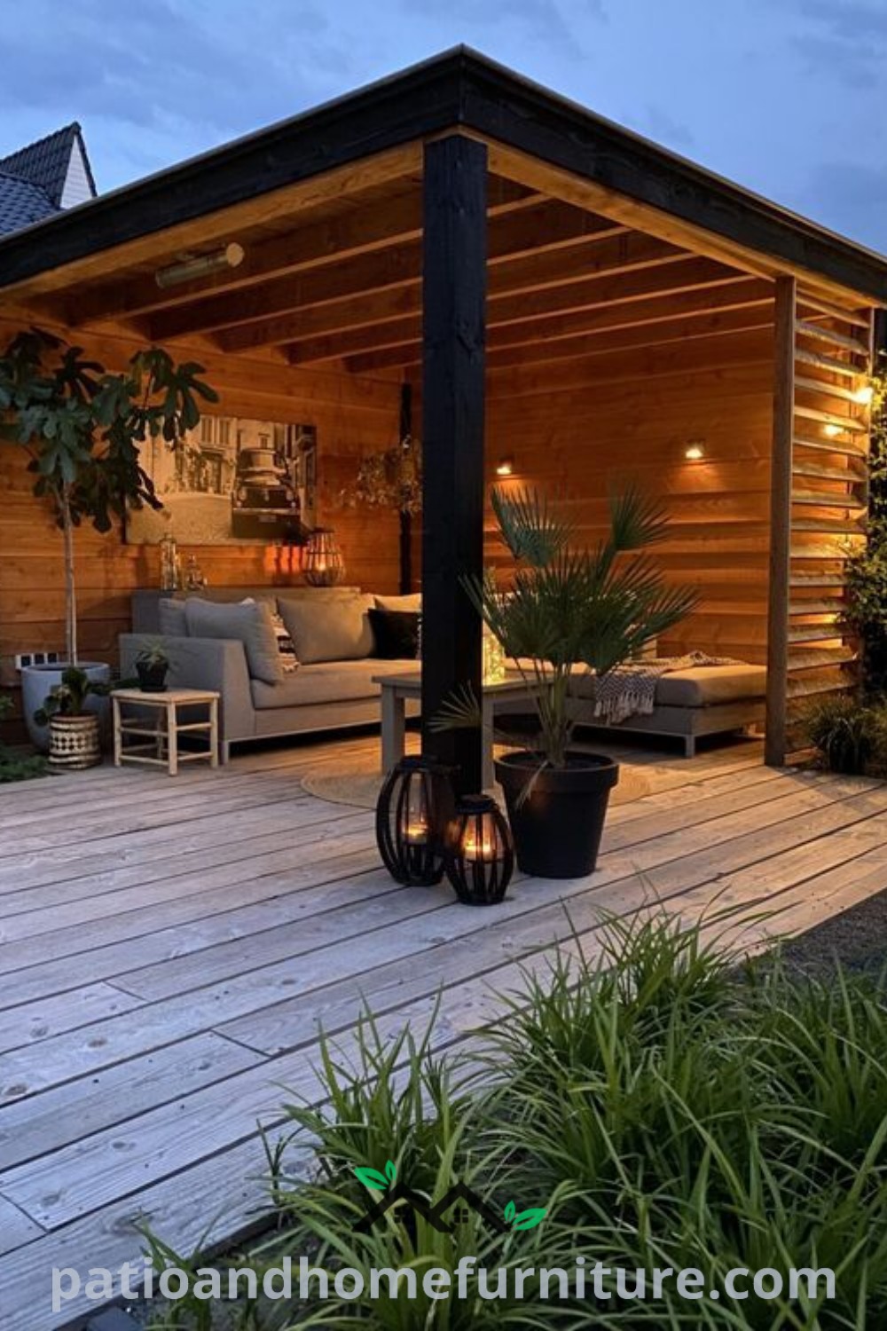 Wooden deck adorned with potted plants and fairy lights in front of a house, creating a cozy outdoor atmosphere ideal for relaxation and gatherings. Explore more design ideas at wellnesswink.com.