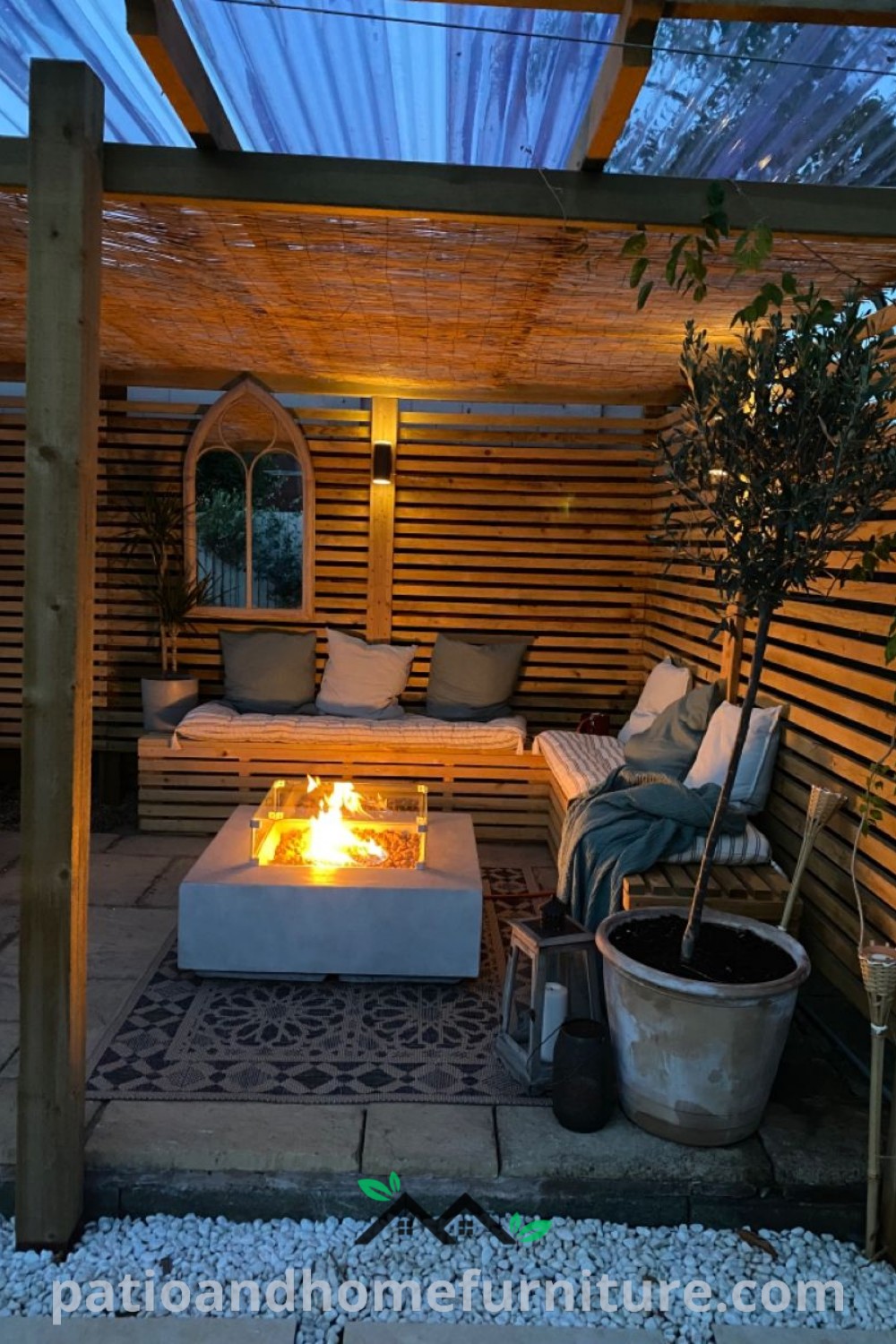 Cozy patio with a fire pit surrounded by two couches and a potted plant, showcasing inviting design ideas for outdoor spaces, perfect for gatherings and relaxation, featured on wellnesswink.com.