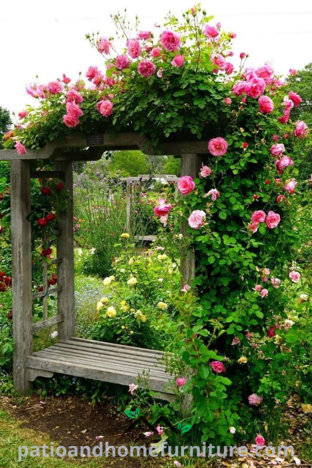 Wooden bench in a garden surrounded by pink flowers and greenery, complemented by a wisteria arbor, showcasing inspiring cozy ideas for home and garden decor at wellnesswink.com.
