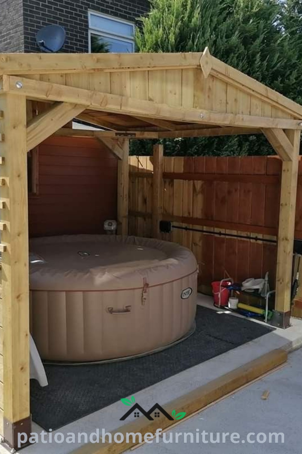 Wooden gazebo with a hot tub in the middle, surrounded by a fence, creating a cozy and inviting outdoor retreat perfect for relaxing and unwinding, with unique design ideas from wellnesswink.com.