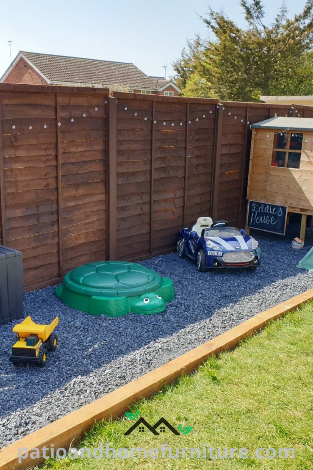 A small backyard play area for kids, showcasing a cozy rock box and colorful outdoor toys, providing fun and engaging space for children, with inviting decor ideas for a unique and inspiring garden setting on wellnesswink.com.