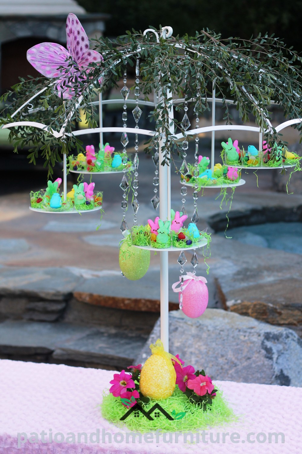 Table with a decorated tree, vibrant flowers in the center, and cupcake stands, creating a cozy and inviting celebration setup, showcasing unique ideas for decor inspirations on wellnesswink.com.