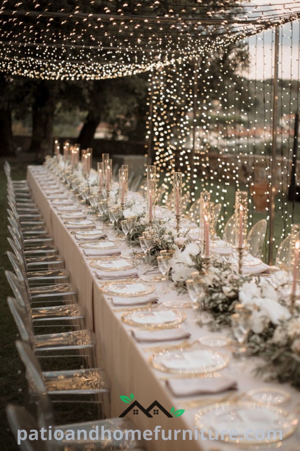 Long wedding reception table elegantly decorated with white flowers and candles, creating a cozy and inviting atmosphere, accompanied by bistro lights for added charm, featured on wellnesswink.com.
