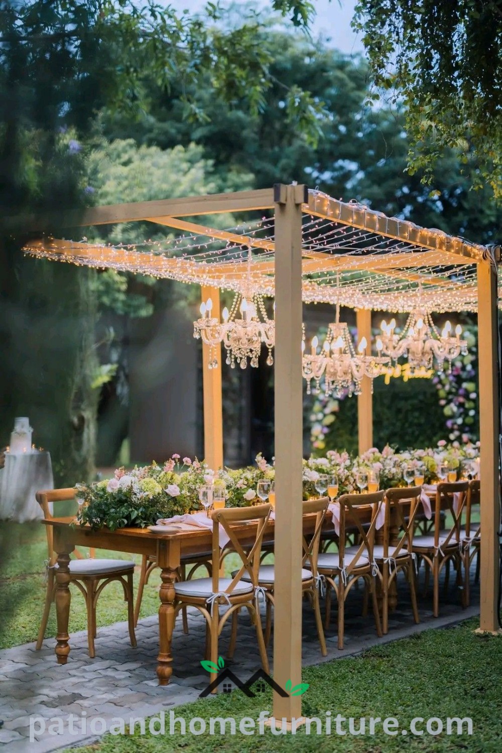 Outdoor dining setup featuring a chandelier, flower decorations on the table, and a cozy ambiance, ideal for events and gatherings, with aesthetic decor inspirations, unique ideas for your home, and design ideas from wellnesswink.com.