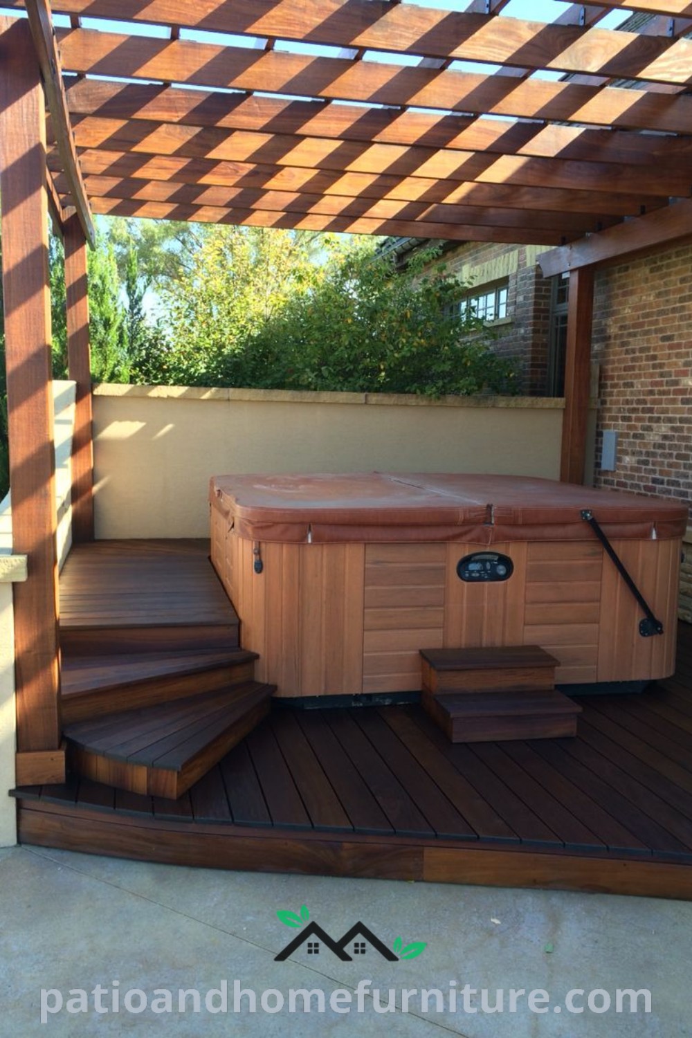 Hot tub sitting on a wooden deck under a pergola, surrounded by cozy decor and ambient lighting, providing inspiring ideas for a serene backyard retreat, as seen on wellnesswink.com.