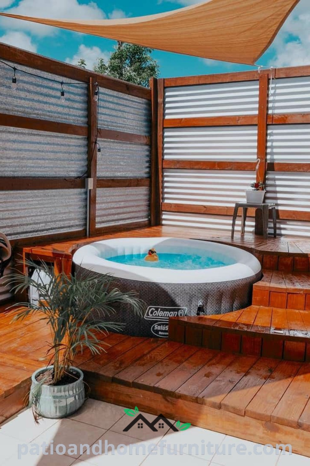 Cozy hot tub on a wooden deck beside a fenced area, surrounded by nature, offering unique decor ideas for an inviting outdoor retreat at wellnesswink.com.