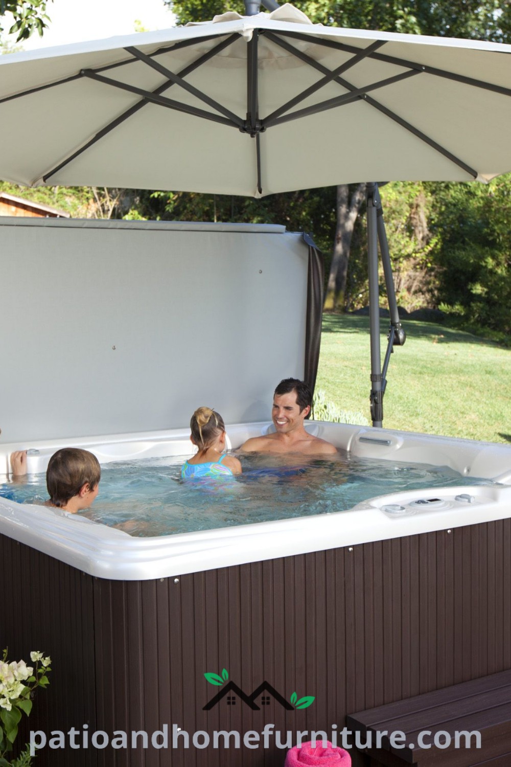 Group of people enjoying a cozy hot tub under an umbrella, set on a stylish patio, creating a perfect outdoor Jacuzzi atmosphere for relaxation and social gatherings, featuring decor ideas and inspirations from wellnesswink.com.