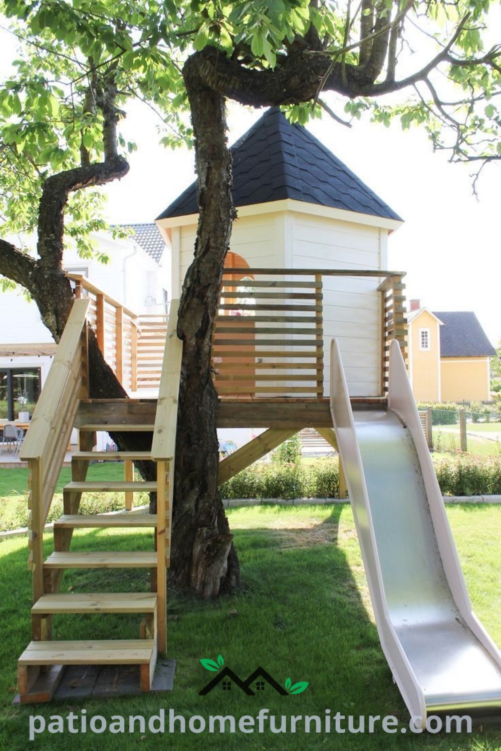 Slide in the grass next to a tree, creating a playful outdoor area with cozy ideas and unique designs for kids