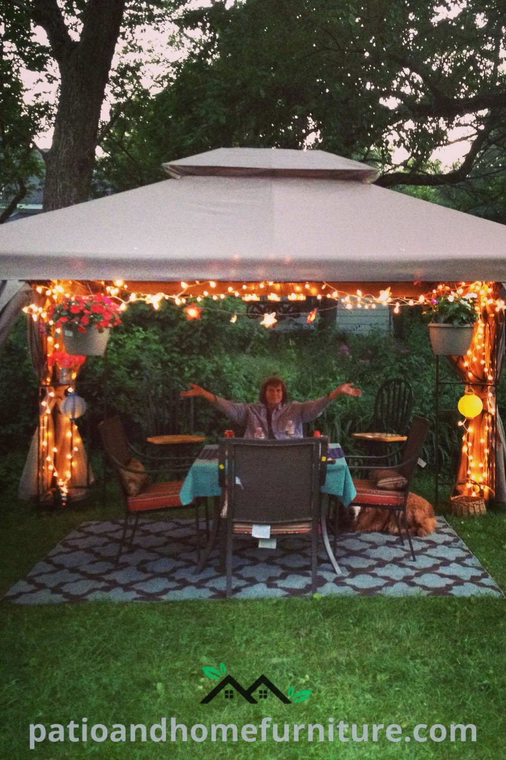 Cozy outdoor tent setup in a backyard featuring string lights, comfortable seating, and personal decor touches, providing inviting and affordable design ideas for a charming outdoor space, showcased on wellnesswink.com.