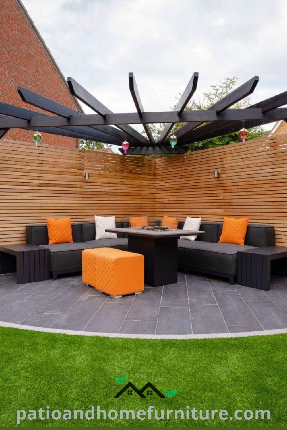 Outdoor living area showcasing black and orange furniture, creating a stylish and inviting setup for relaxation and entertainment in the backyard, featuring cozy ideas and decor inspirations for home arrangements, wellnesswink.com.