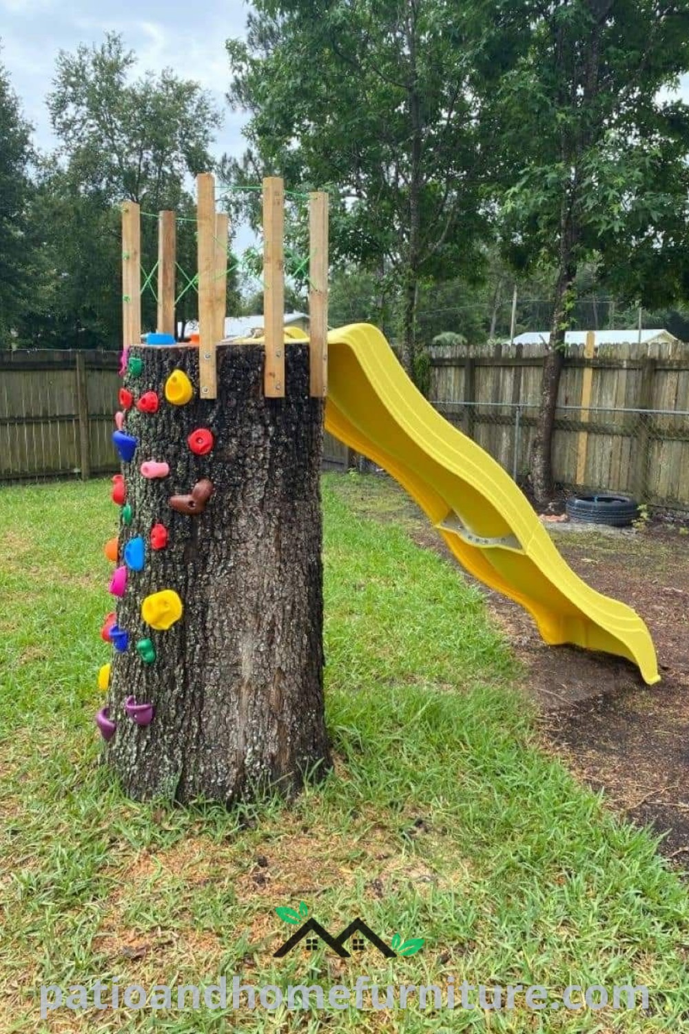 Tree stump with a yellow slide in the middle and colorful balls, showcasing unique outdoor DIY playground ideas for children