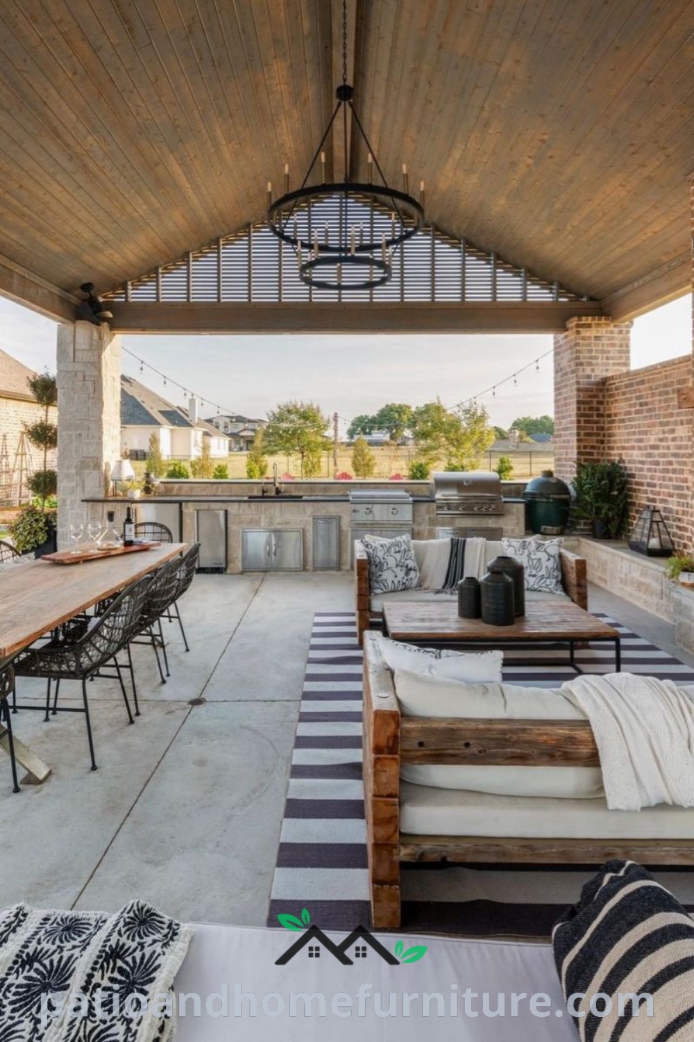 Cozy outdoor covered patio with tables, chairs, and couches, designed for relaxation and family gatherings, featuring a fireplace and inviting decor elements for an inspiring outdoor living space, available at wellnesswink.com.