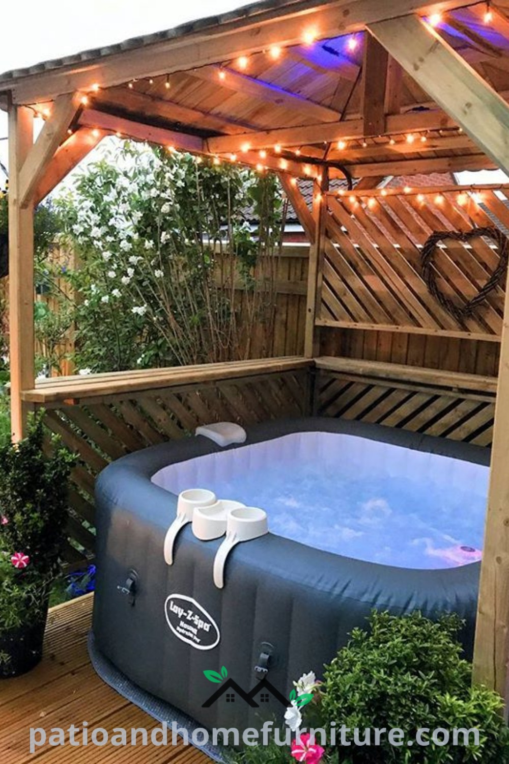Inflatable hot tub on a deck adorned with string lights and potted plants, showcasing cozy ideas for outdoor relaxation and design inspirations for creating a cozy home at wellnesswink.com.