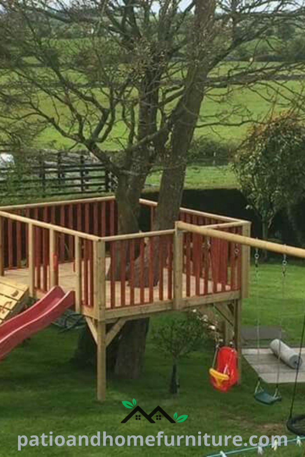 Wooden play set with slide and climbing frame situated in a grassy area around a large tree, featuring swings and decorative elements for a cozy outdoor play space, offering inspiring design ideas for kids