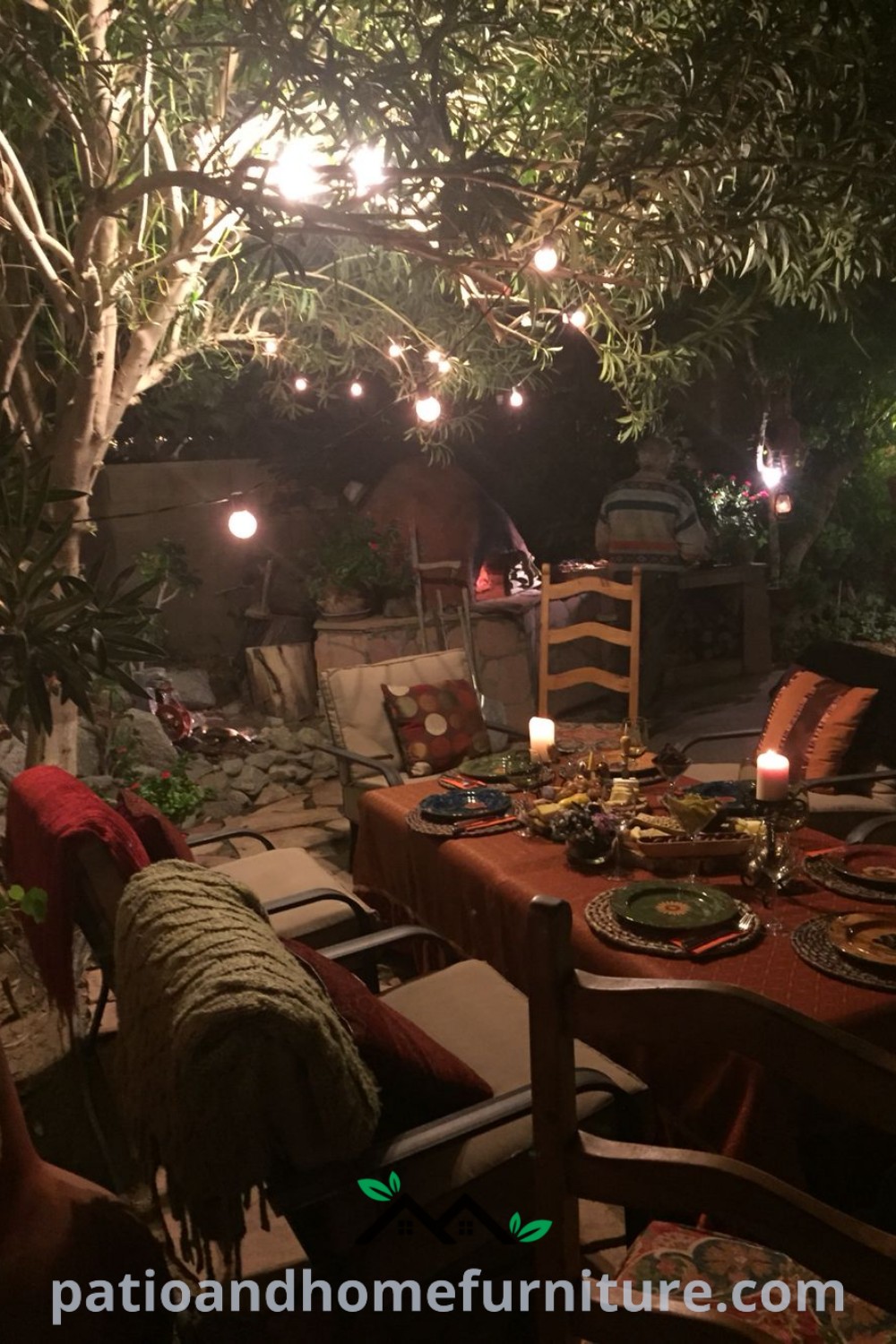 Outdoor dining area illuminated with candles on tables and chairs, creating a warm and inviting atmosphere for evening meals, showcasing cozy ideas and decor inspirations from wellnesswink.com.