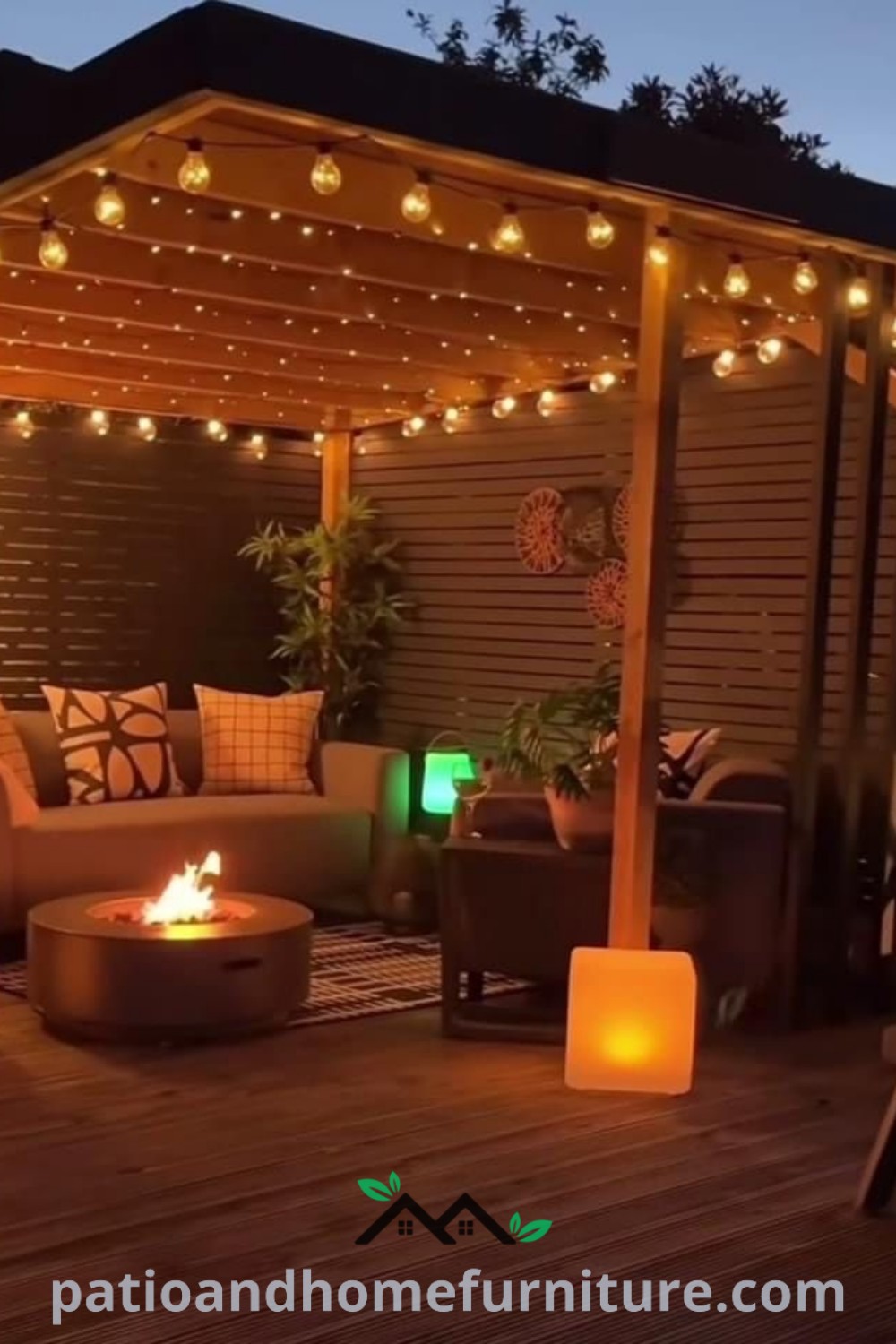 Charming outdoor living area featuring a deck illuminated by candles and lights, surrounded by potted plants, providing cozy ideas and decor inspirations for your home at wellnesswink.com.
