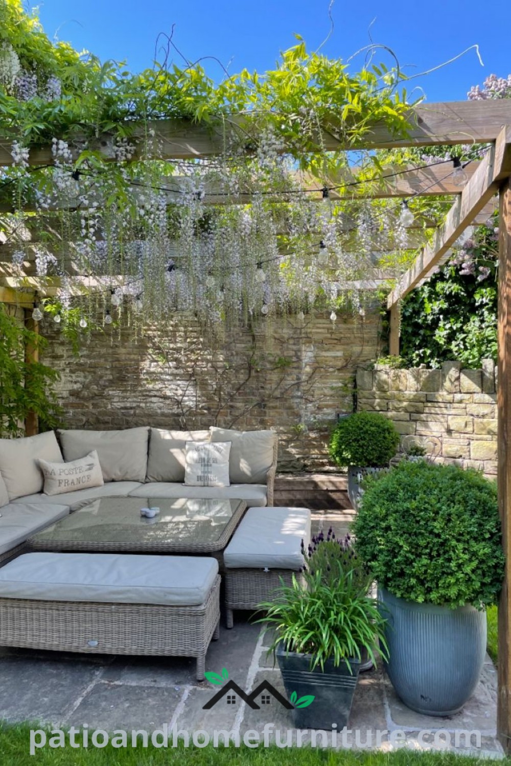 Cozy outdoor living area with comfortable couches and vibrant potted plants, designed for relaxation and entertainment, featuring decor inspirations from wellnesswink.com.