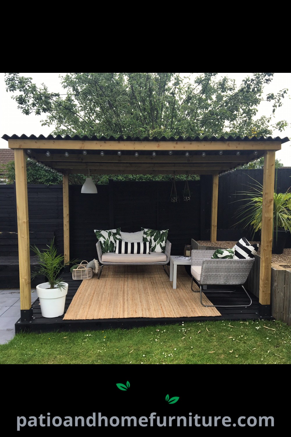 Wooden deck with chairs and a bench surrounded by greenery in a yard, showcasing cozy ideas for backyard decor inspired by wellnesswink.com.
