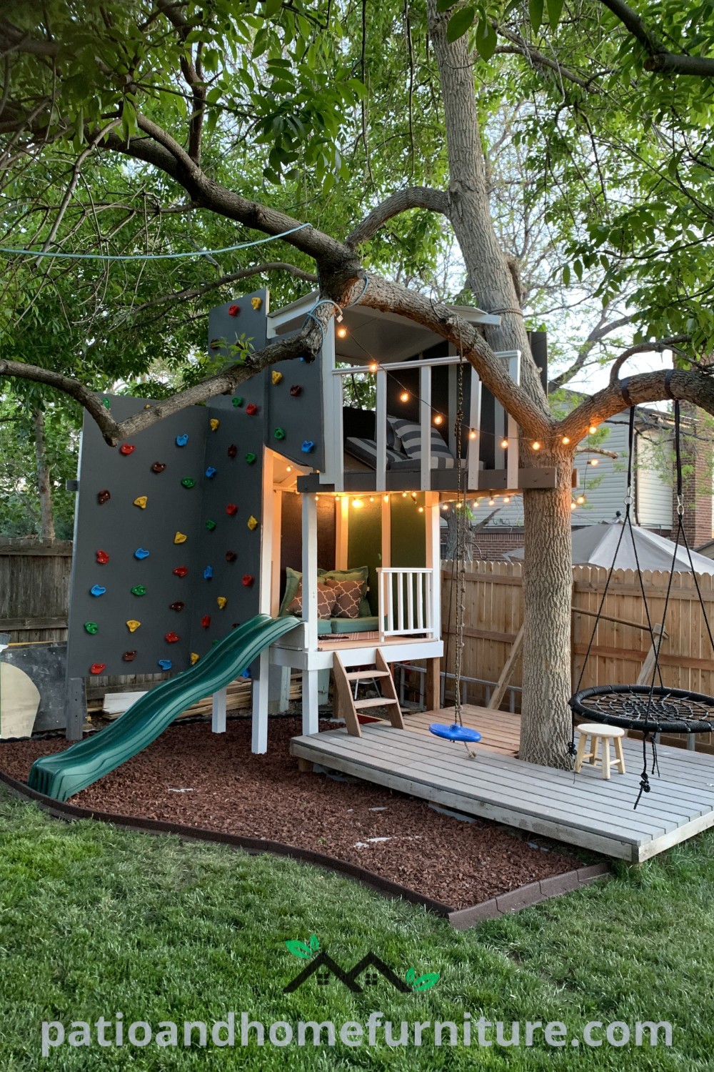 A cozy backyard featuring a large tree, a swing set, and a climbing wall, designed for children’s outdoor play, showcasing delightful decor ideas and inspirations for a fun and inviting space for kids, visit wellnesswink.com.