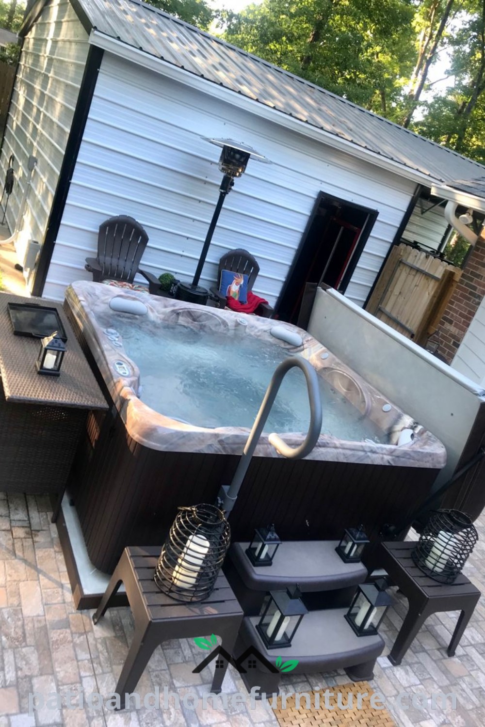 A cozy hot tub elegantly positioned on a patio surrounded by chairs and a table, complemented by inviting decor ideas to create a beautiful outdoor space for relaxation and entertaining, captured on wellnesswink.com.
