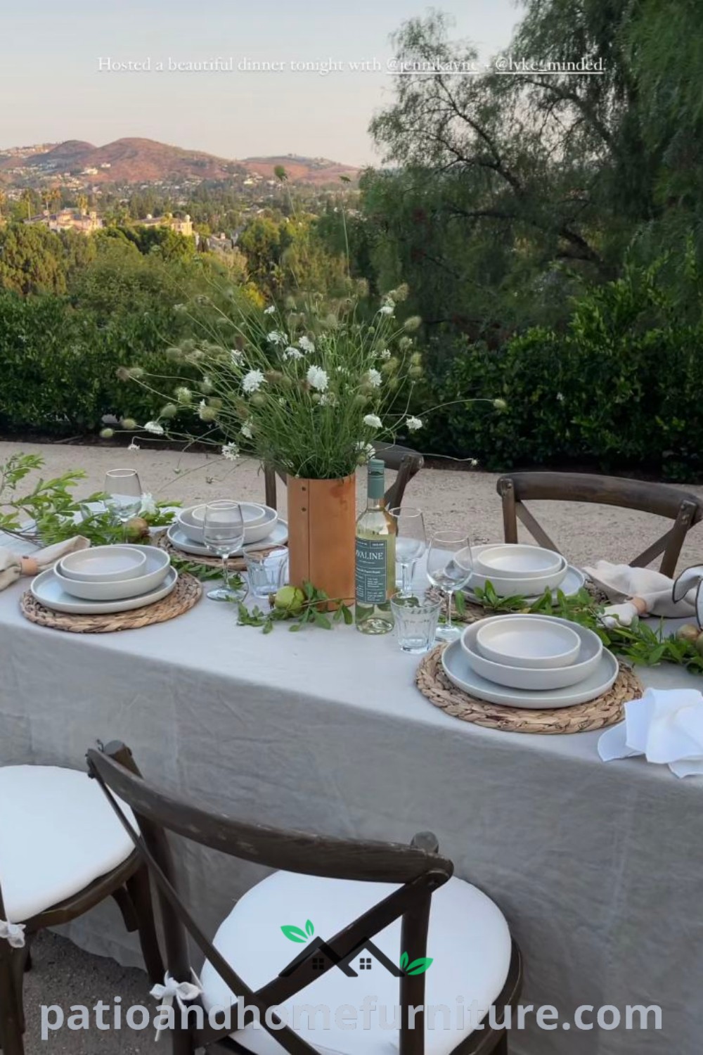 Stylish birthday lunch table with plates, silverware, and floral vases set up on a balcony, providing cozy ideas and decor inspirations for outdoor celebrations, featured on wellnesswink.com.