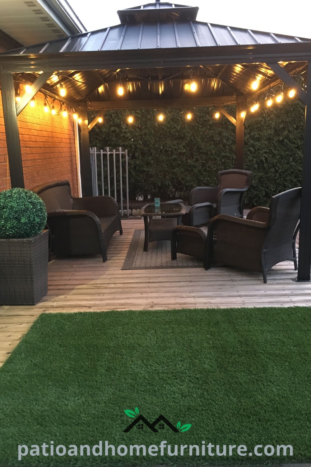 Charming outdoor patio with cozy chairs under twinkling lights, lush grass in front, ideal for gatherings and relaxation, showcasing unique ideas for decor inspirations at wellnesswink.com.