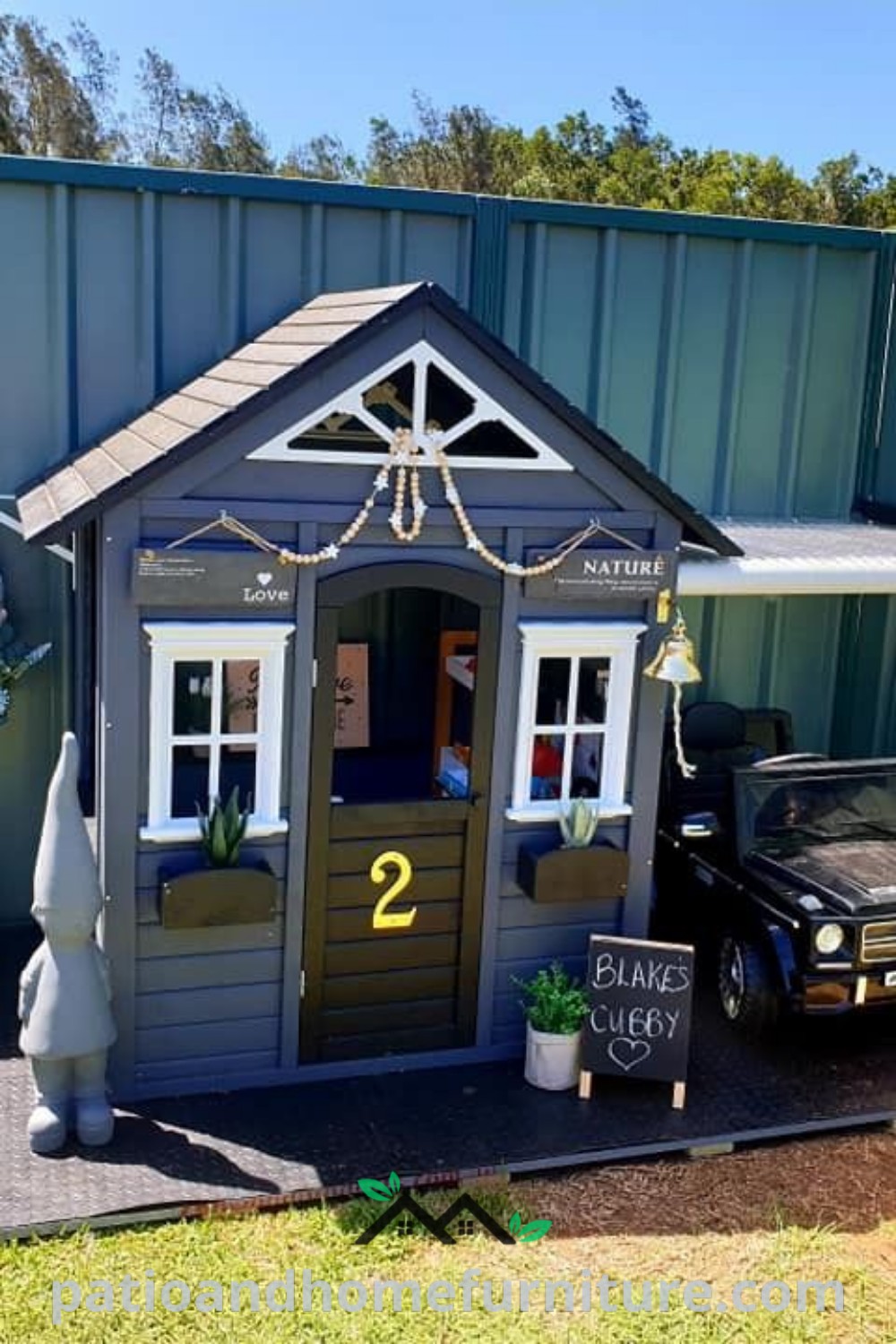 A cozy car parked in front of a small shed with a porch and awning, alongside a charming boys