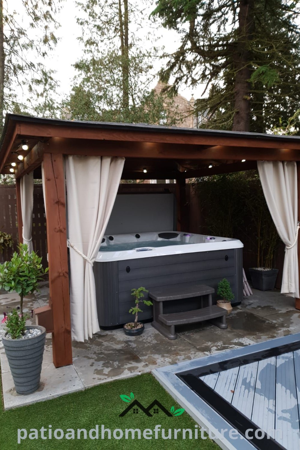Outdoor hot tub surrounded by curtains in a backyard, with cozy decor ideas enhancing a tranquil atmosphere, perfect for relaxation, featured on wellnesswink.com.